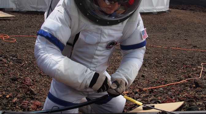 Ross working on the Habitat's water sensor line in the MX-C suit. Photo: Casey Stedman