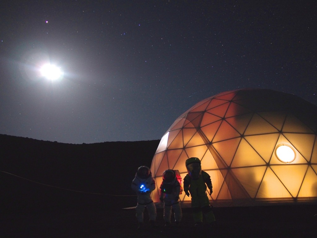 Martian astronomers pose for a photograph in front of the HI-SEAS habitat.