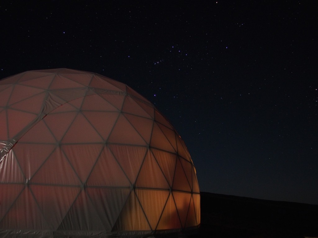 Orion walks along the curvature of the dome.